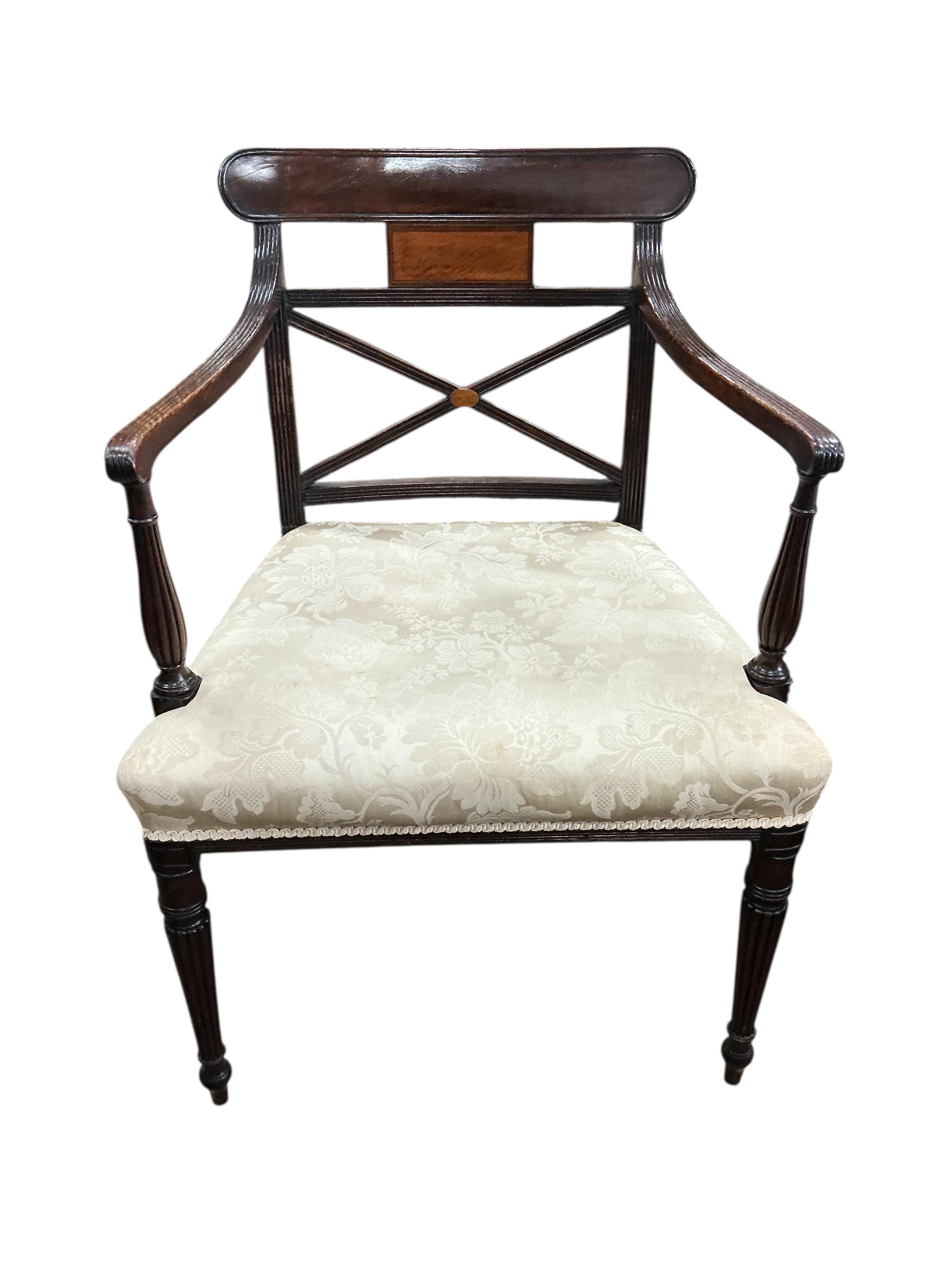 A set of eight Regency mahogany dining chairs, one with arms